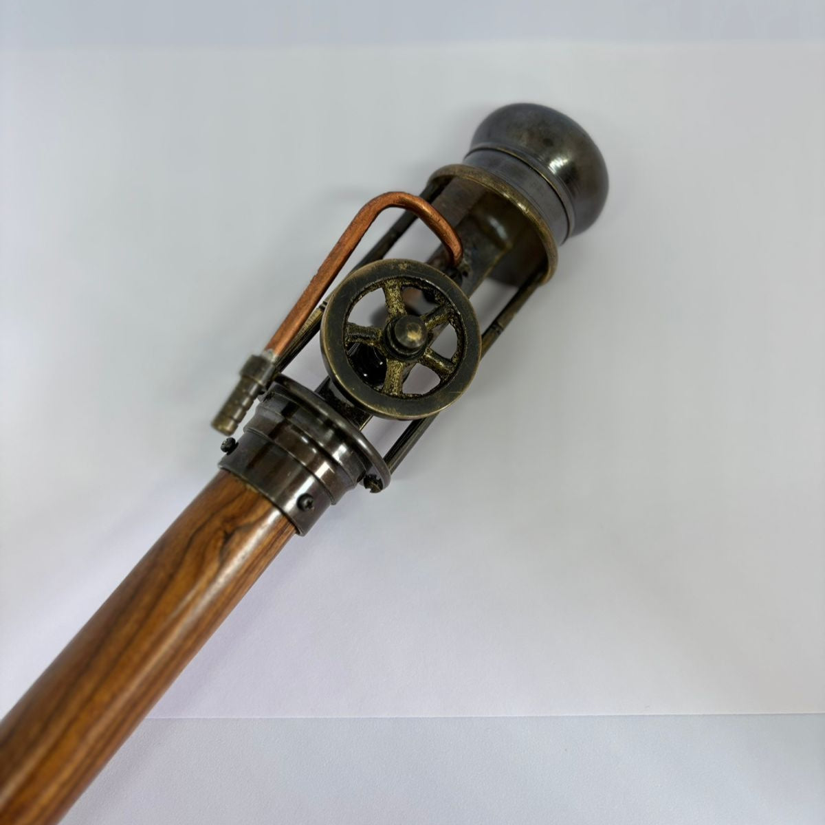steampunk walking cane
gear handle walking stick
mechanical handle cane
steampunk cosplay accessory
collectible walking stick
vintage gadget cane
gentleman’s steampunk cane
industrial gear walking stick
handmade wooden cane
novelty steampunk gift
steampunk engineer prop
mechanical wheel cane
steampunk costume accessory