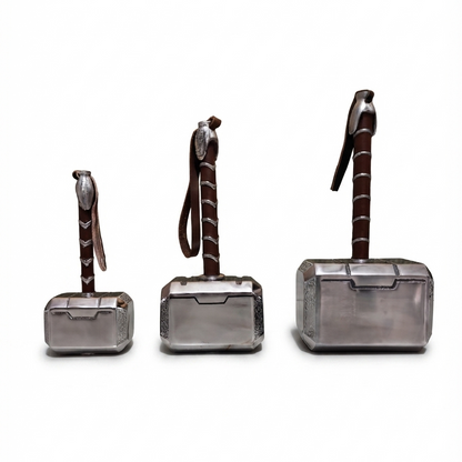 Three metallic Thor's Hammer-shaped box organizers in different sizes, arranged from left to right on a plain white background.